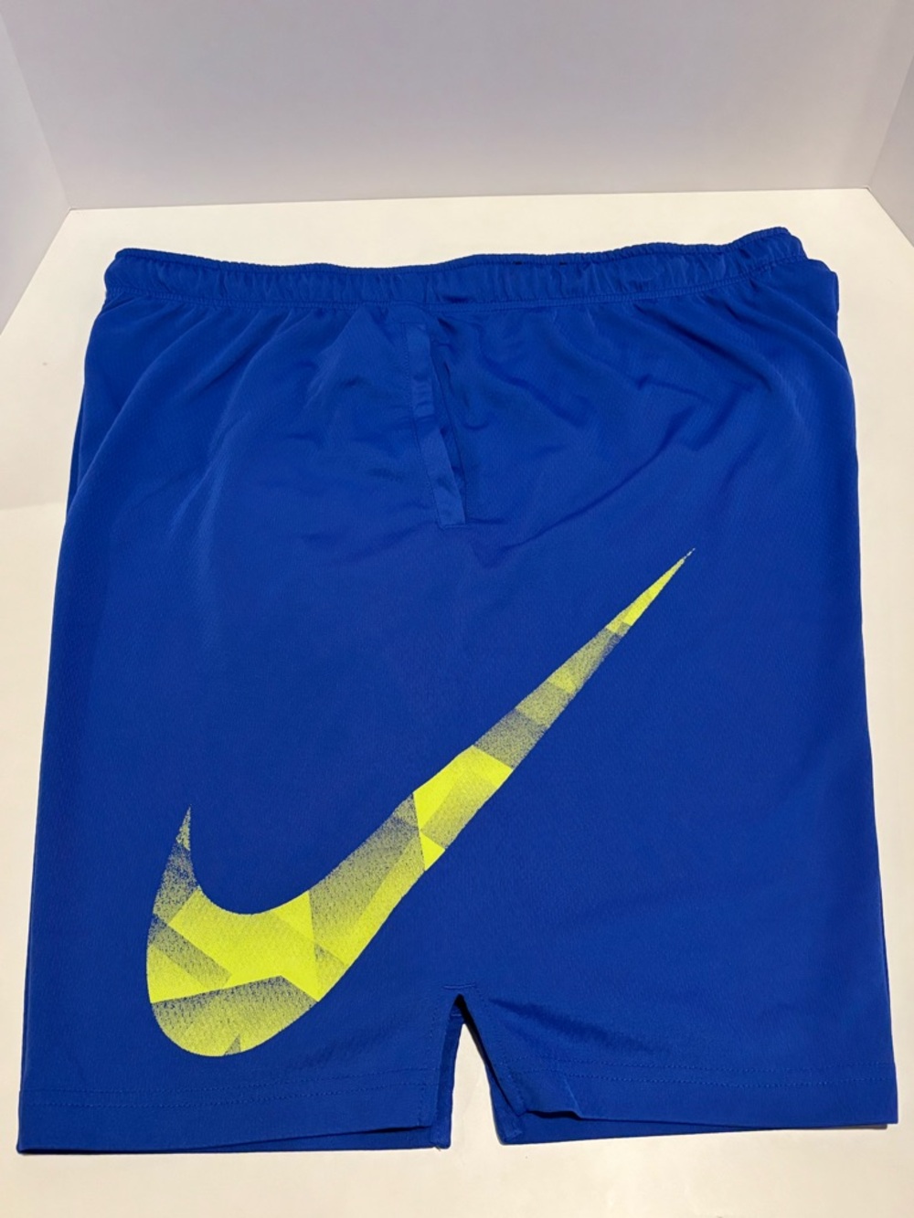 Nike Men’s Blue Athletic Shorts with Yellow Swoosh